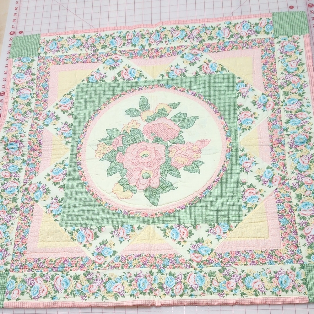 Floral Patchwork Quilt with Green and Pink Accents